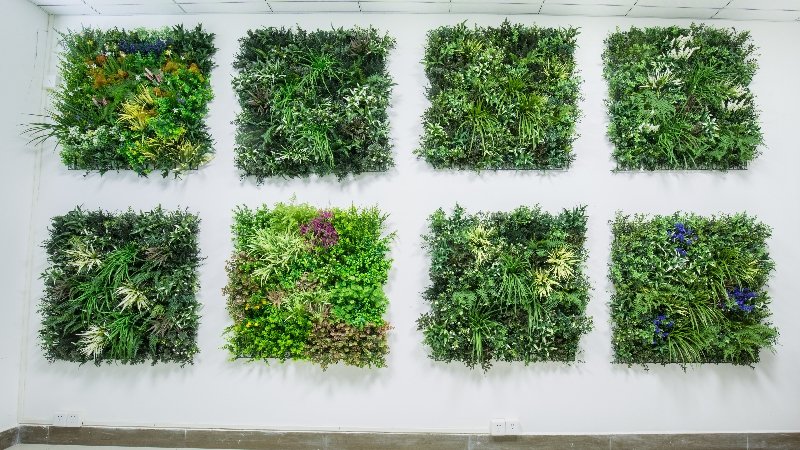 A warehouse full of artificial plant wall panels ready for shipping